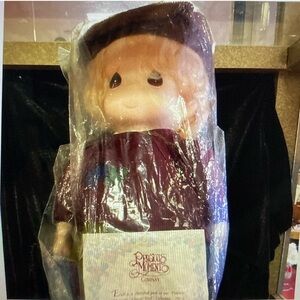 Precious Moments Doll with Burgundy Outfit #2058 off of 5,000
1994